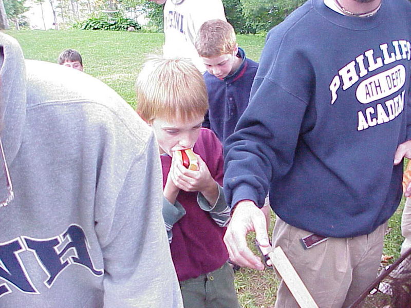 File:Adam enjoying his dog.jpg